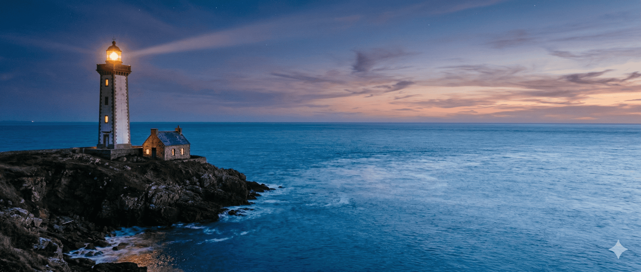 Lighthouse on rocky coast at sunset, guiding ships at sea.